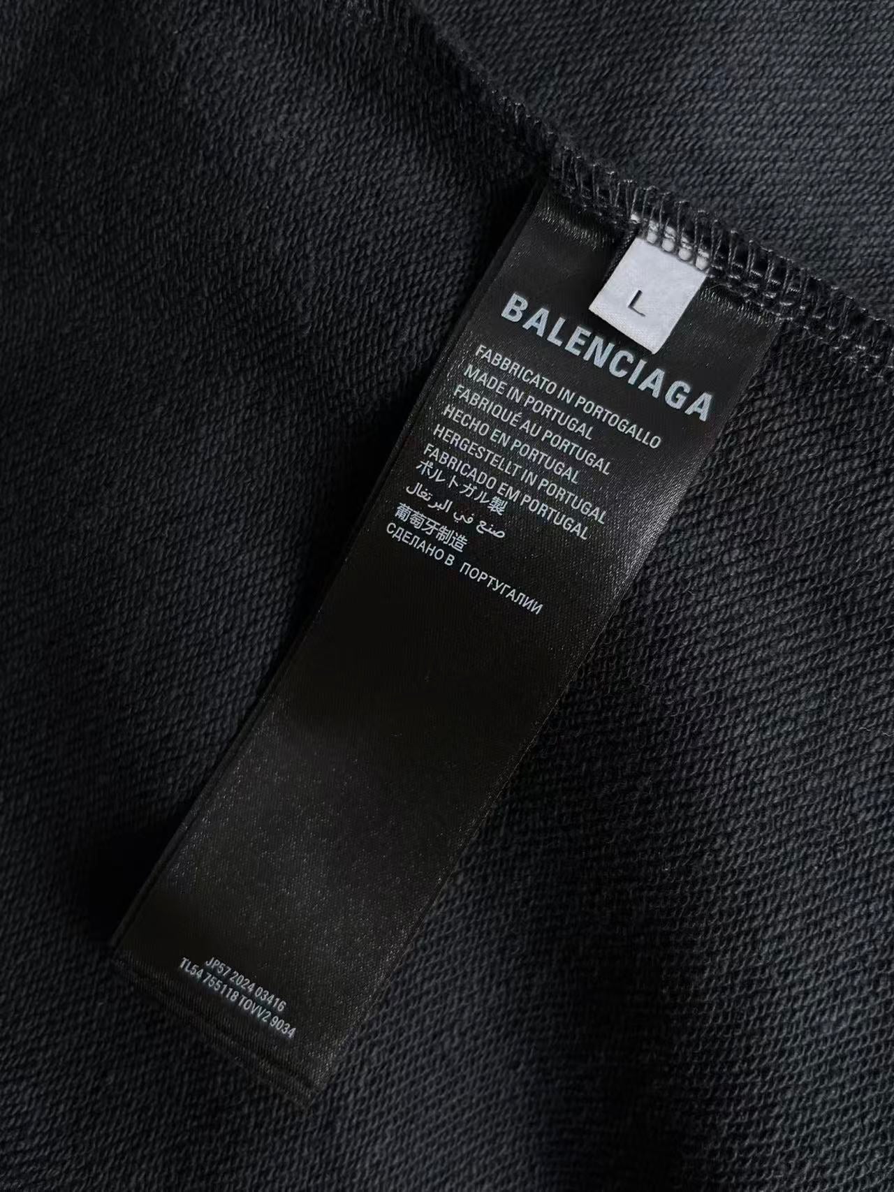 Balenciaga inside label on dark navy zip hoodie collar