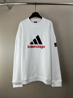 White long-sleeve sweatshirt with black and red Balenciaga graphic logo on chest