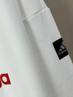 White long-sleeve sweatshirt sleeve patch with Balenciaga logo near cuff