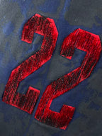Balenciaga embroidered red 24 lettering on blue hoodie fabric