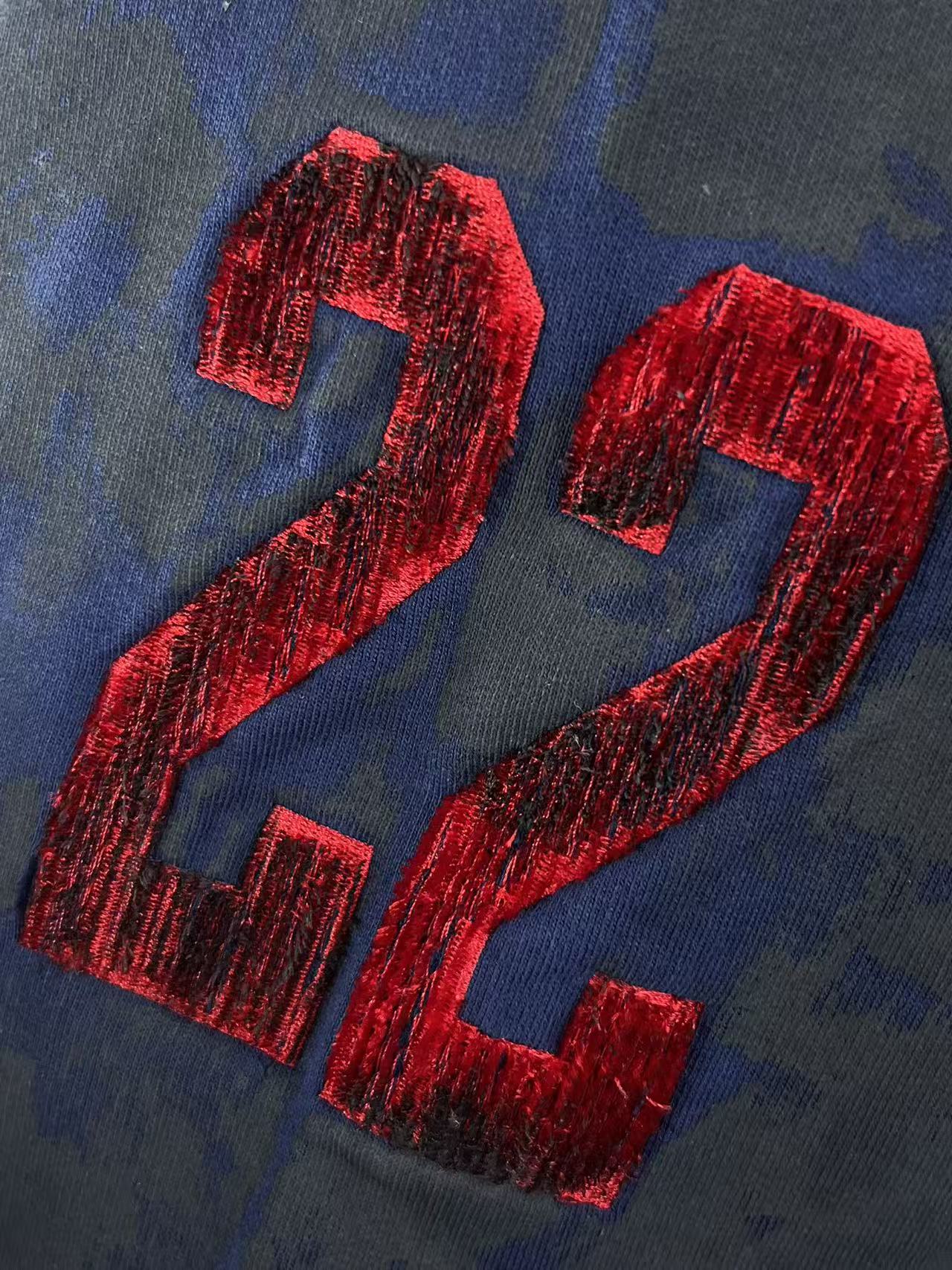 Balenciaga embroidered red 24 lettering on blue hoodie fabric