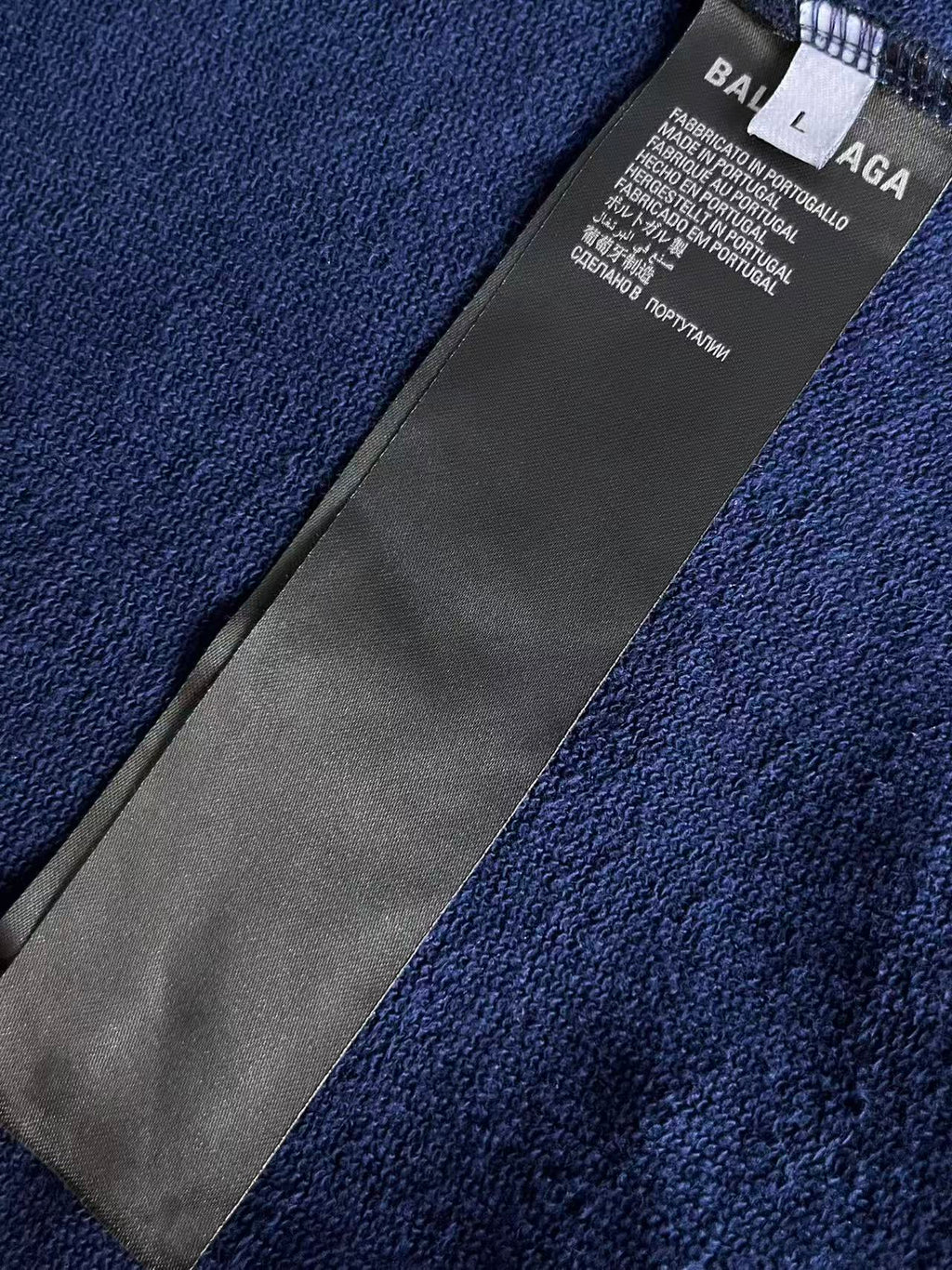Balenciaga neck label inside blue zip-up hoodie collar