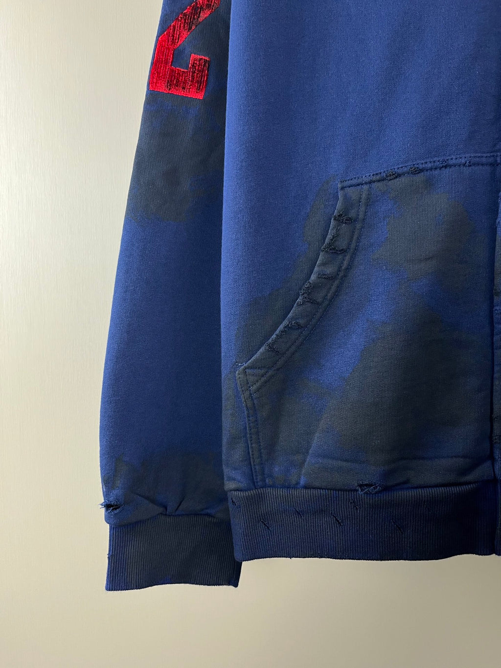 Balenciaga blue zip-up hoodie sleeve detail with red 2 patch and front pocket