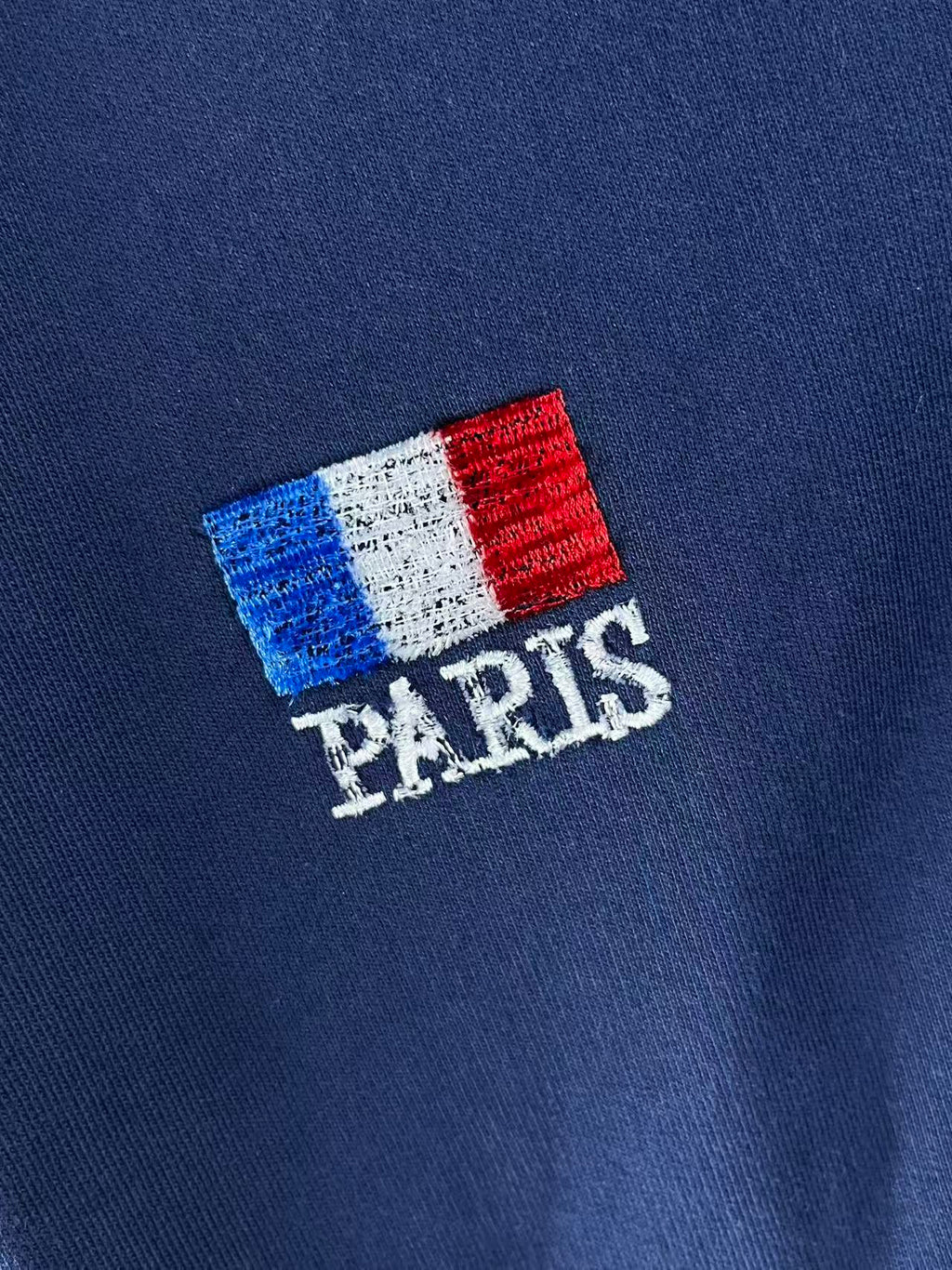 Balenciaga PARIS flag patch on blue hoodie fabric