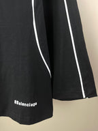 Black jersey with white vertical side stripes and 8Balenciaga logo
