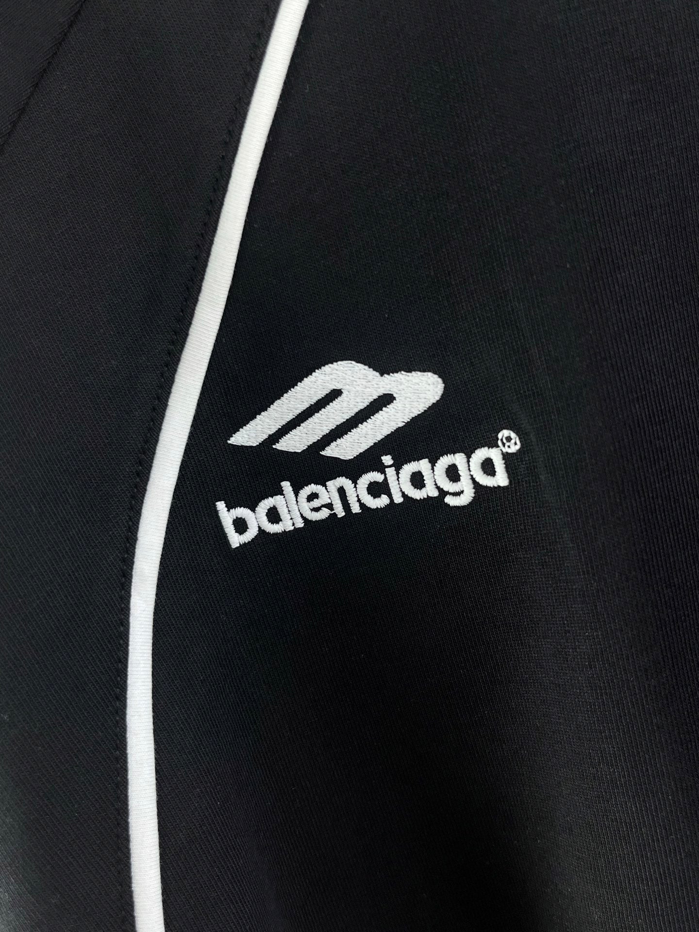 balenciaga logo on black jersey with white side stripe