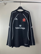 Black long-sleeve jersey with white piping and crest logo at chest