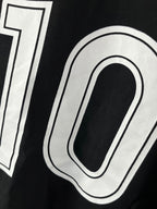 White outlined 10 print on black jersey