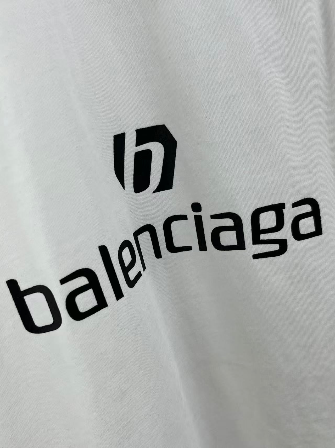 White jersey with Balenciaga logo print across center