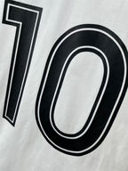 White jersey detail with black 10 graphic and double-line outline