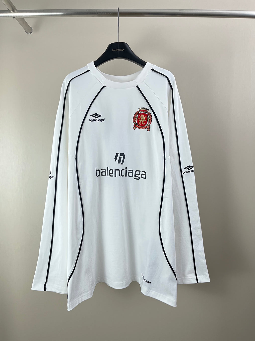 White long-sleeve jersey with Balenciaga logos and crest patch on chest