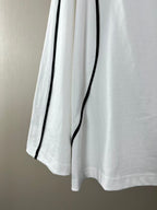 White long-sleeve jersey with curved hem and vertical black piping