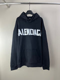 Balenciaga long hoodie in dark navy with front logo lettering and kangaroo pocket