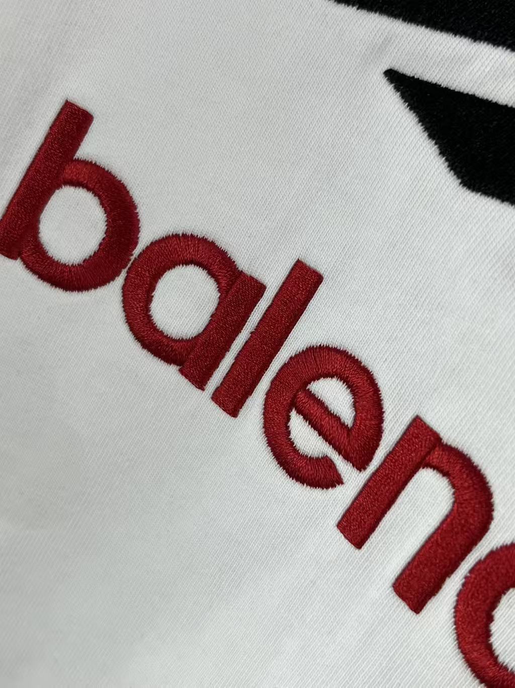 White T-shirt with red Balenciaga logo lettering graphic