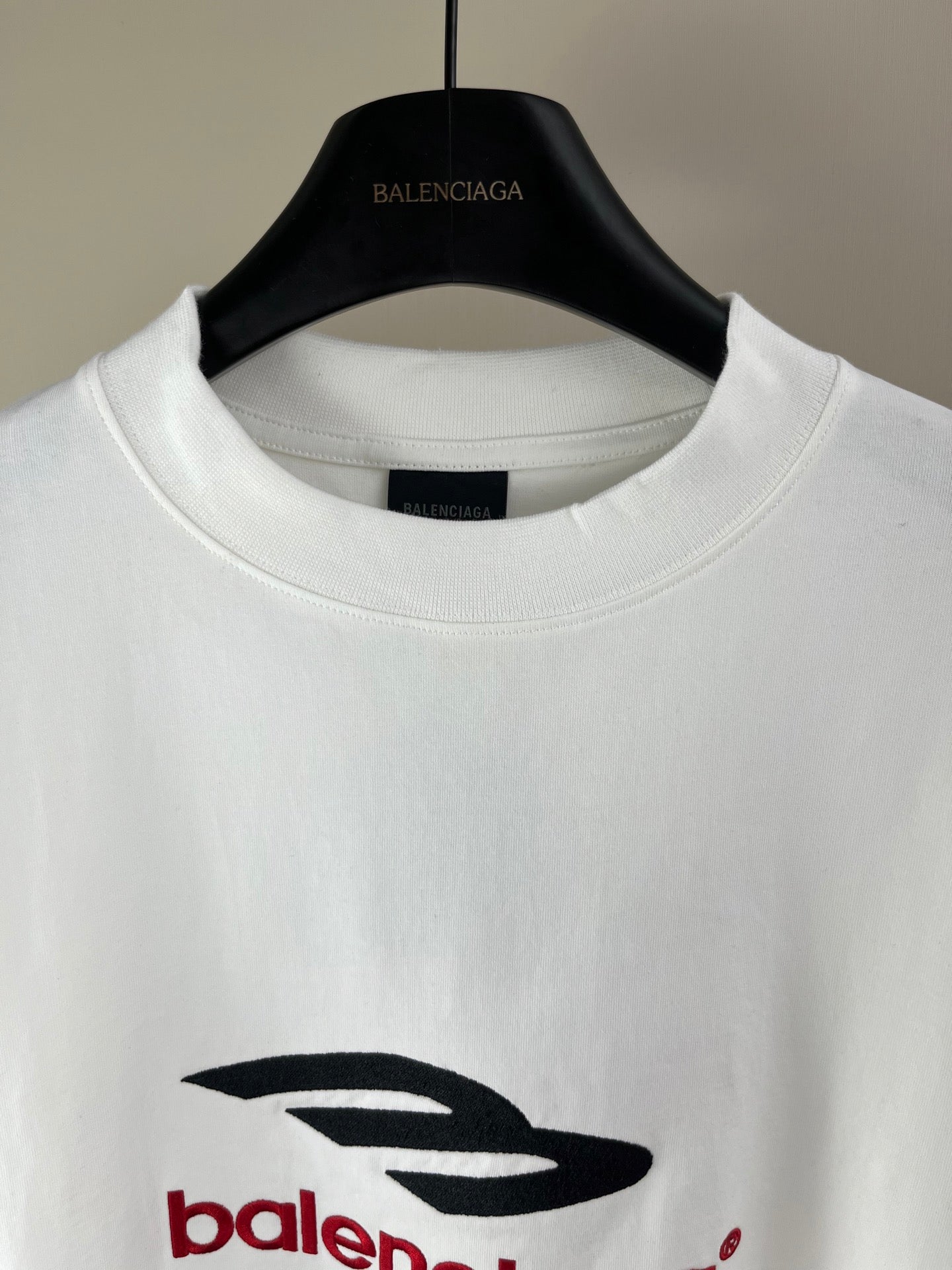 White crewneck long-sleeve T-shirt with Balenciaga logo on chest