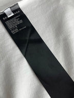 White T-shirt with black neck label and care text