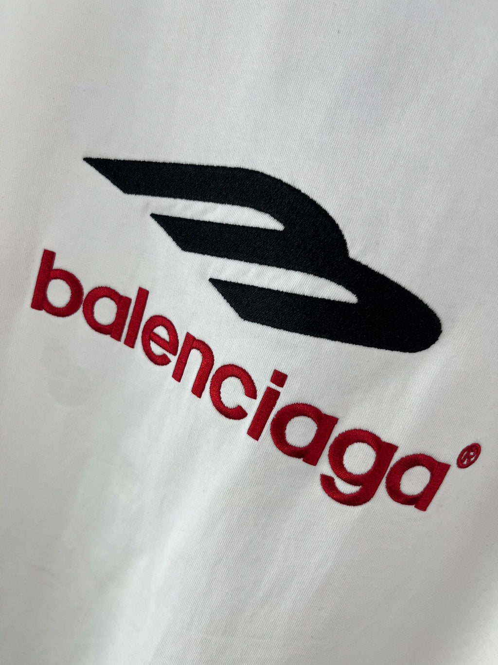 White T-shirt with large black and red Balenciaga logo graphic