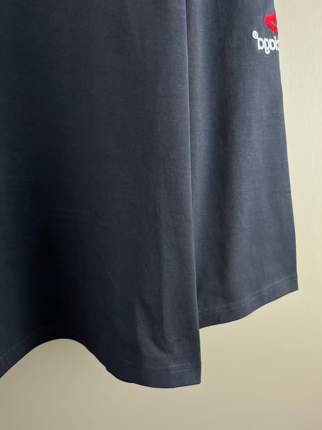 Navy long-sleeve T-shirt with curved hem and small logo on sleeve cuff