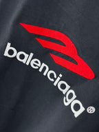 Navy long-sleeve T-shirt with red Balenciaga emblem and white wordmark