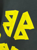 Balenciaga long-sleeve T-shirt graphic V and A letters, yellow on dark fabric