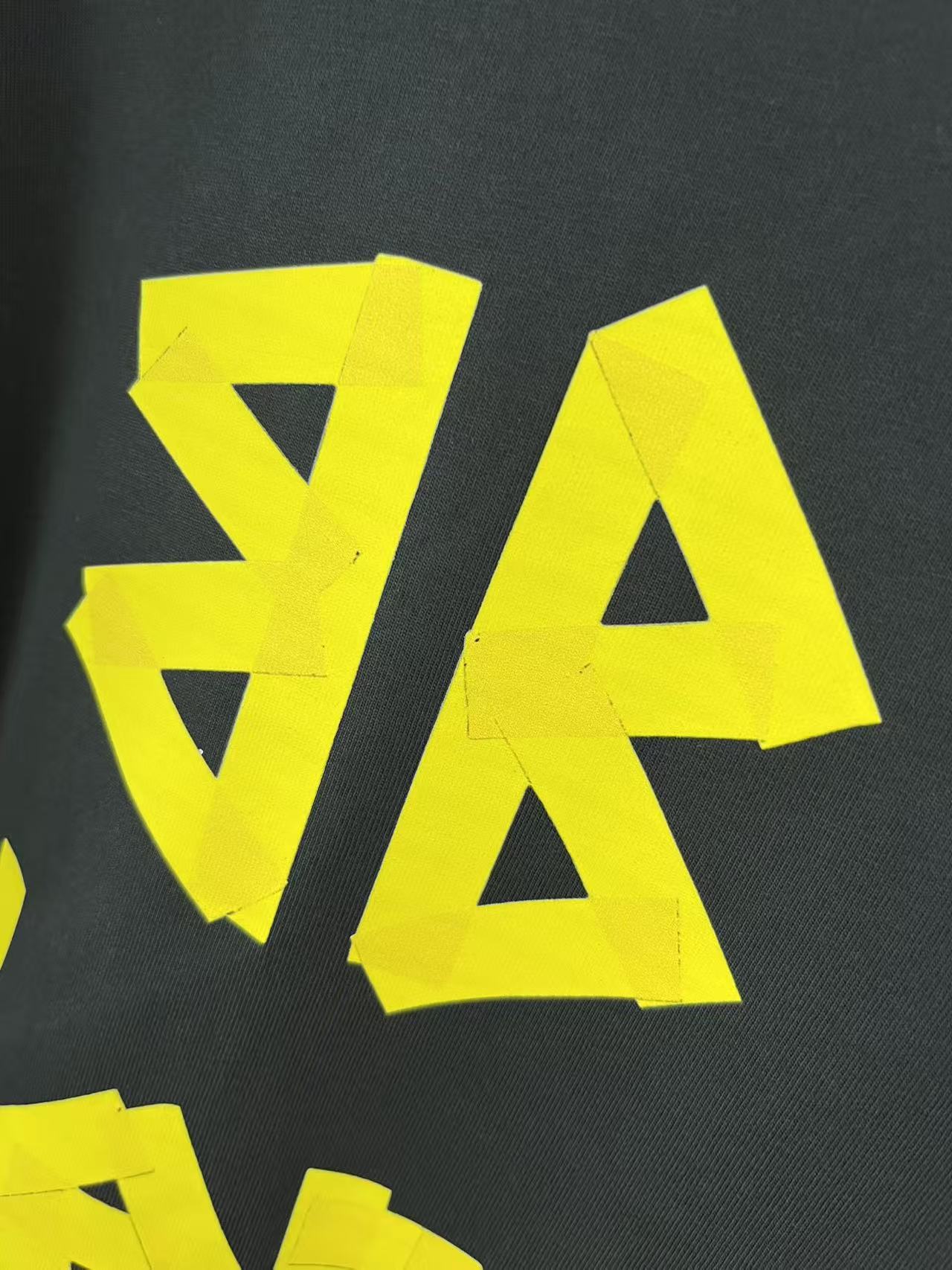 Balenciaga long-sleeve T-shirt graphic V and A letters, yellow on dark fabric