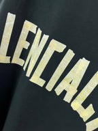 Balenciaga long-sleeve T-shirt lettering graphic in off-white on dark fabric