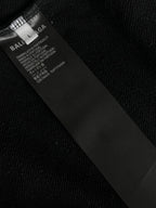 Balenciaga care label at inner neckline on dark long-sleeve T-shirt