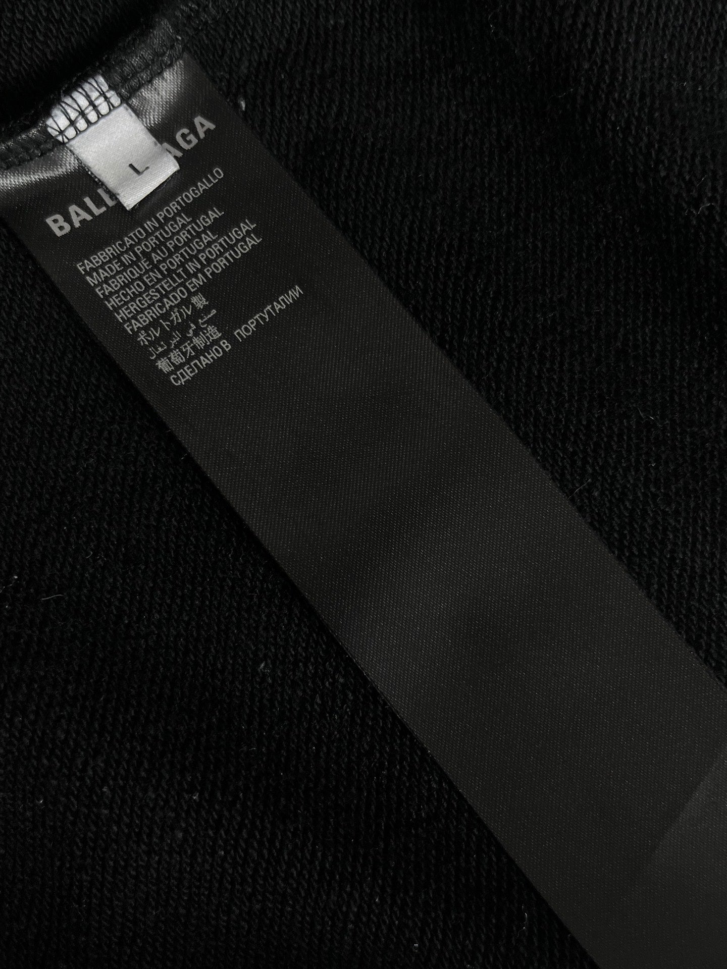Balenciaga care label at inner neckline on dark long-sleeve T-shirt