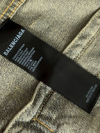Balenciaga denim jacket inner label at neck on black fabric tag