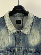 Washed blue denim jacket collar with button placket and inner label