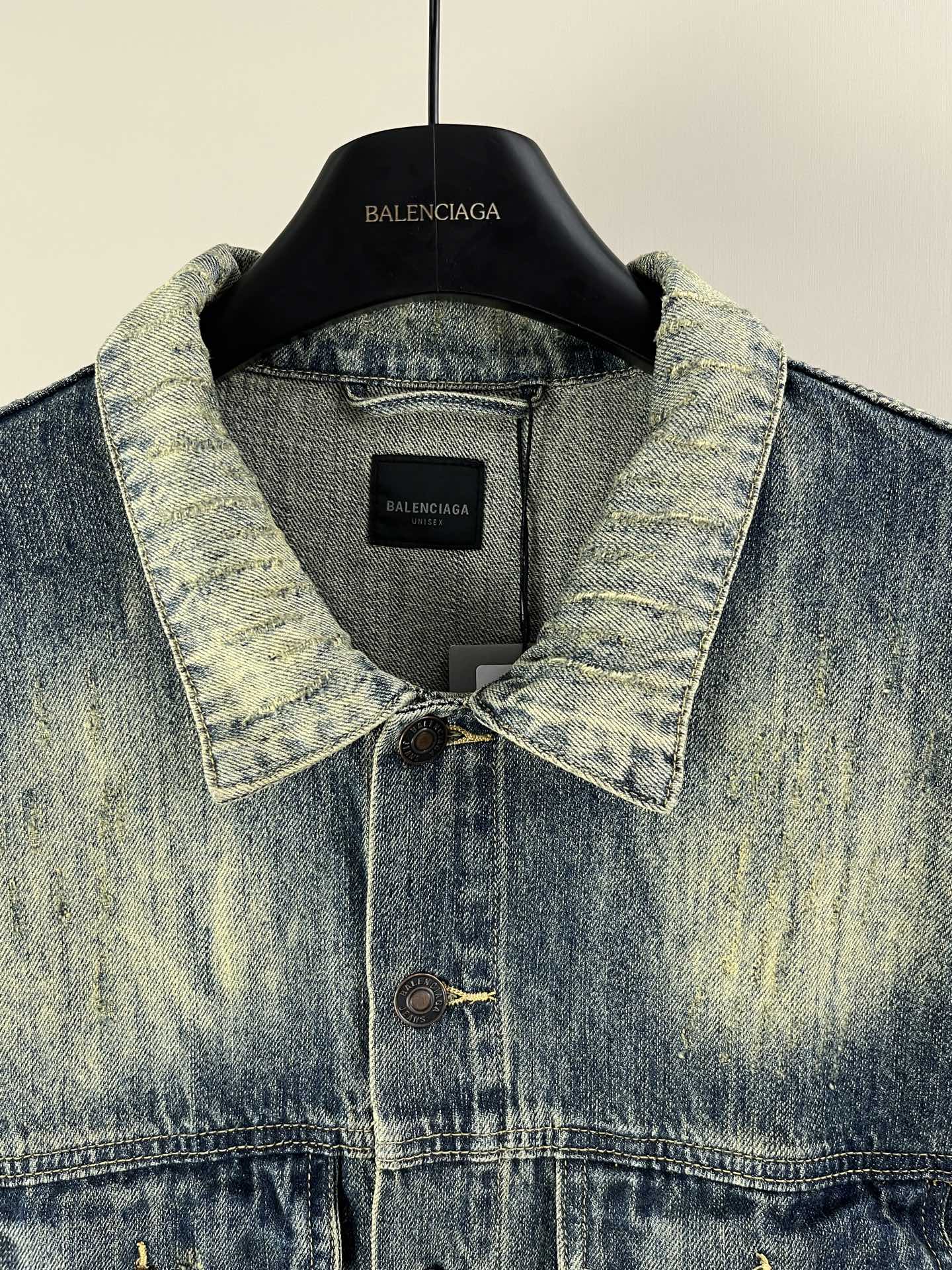 Washed blue denim jacket collar with button placket and inner label