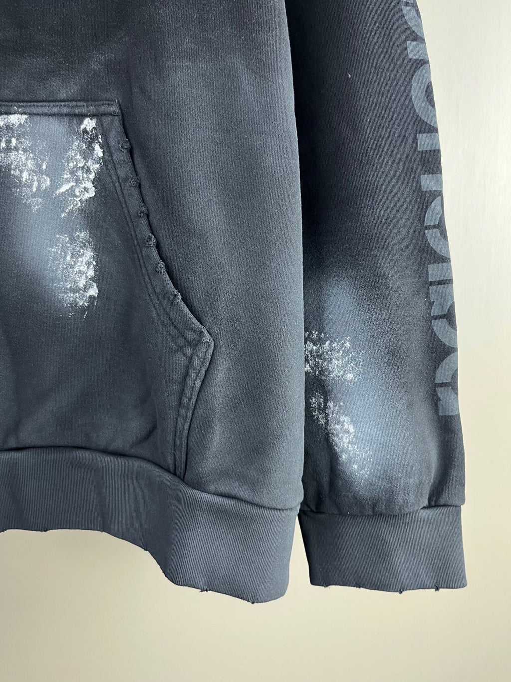 Long hoodie hem and pocket panel with metallic logo and printed sleeve graphic