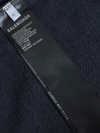 Navy hoodie inside care label with fabric and size information