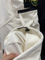 Stone Island off-white pocket opening with black drawcord detail