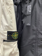 Stone Island off-white pants with logo patch and inner label