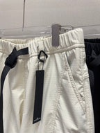 Stone Island off-white pants with elastic waistband and hanging tags
