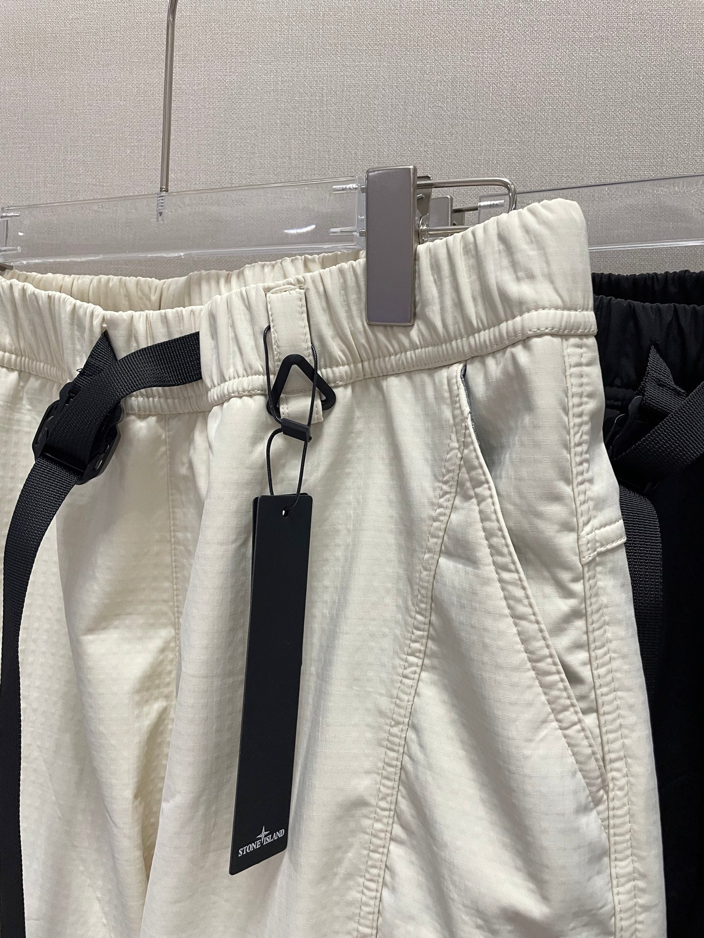 Stone Island off-white pants with elastic waistband and hanging tags