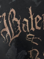 Balenciaga logo print on dark hoodie fabric, close-up of script lettering
