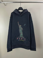 Balenciaga dark hoodie with hood and front pouch, Paris graphic on chest and sleeve cuffs