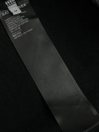 Balenciaga dark clothing care label inside collar with fabric and country details