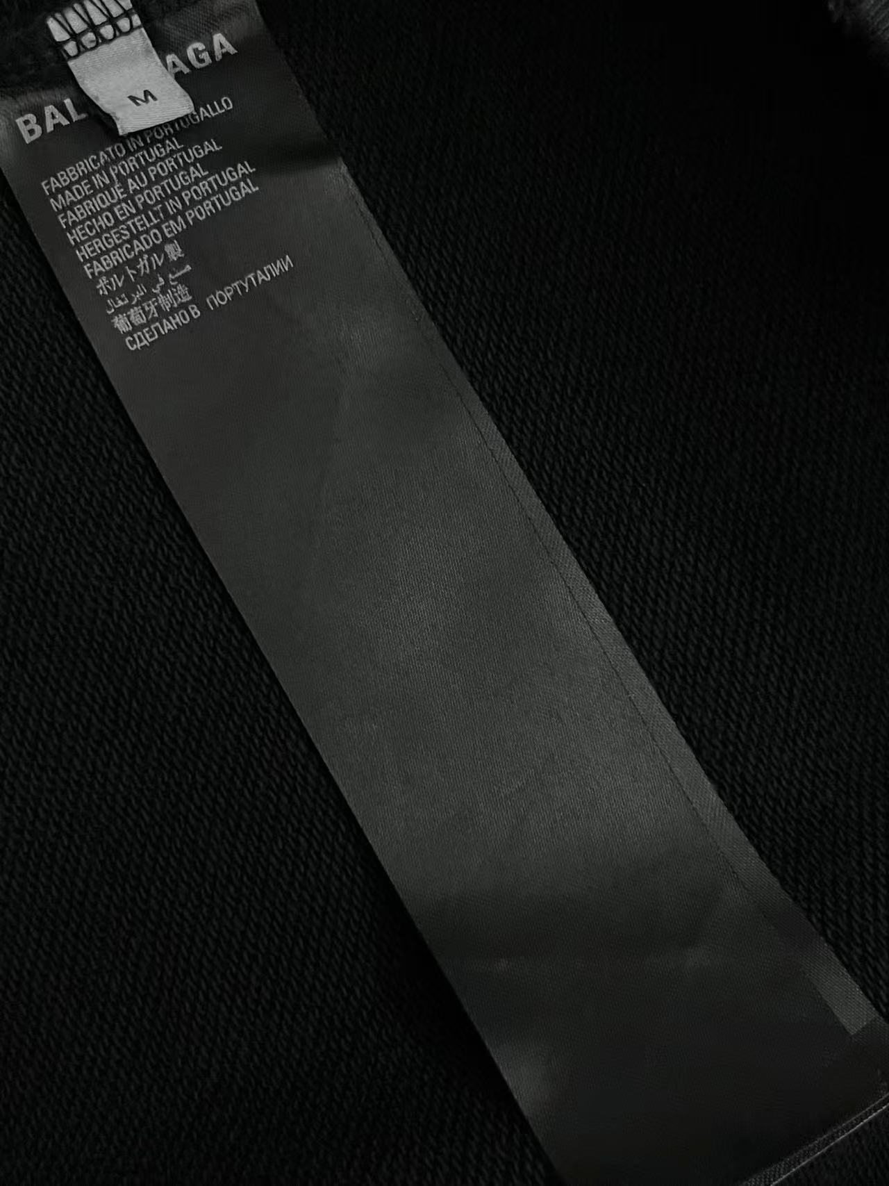 Balenciaga dark clothing care label inside collar with fabric and country details