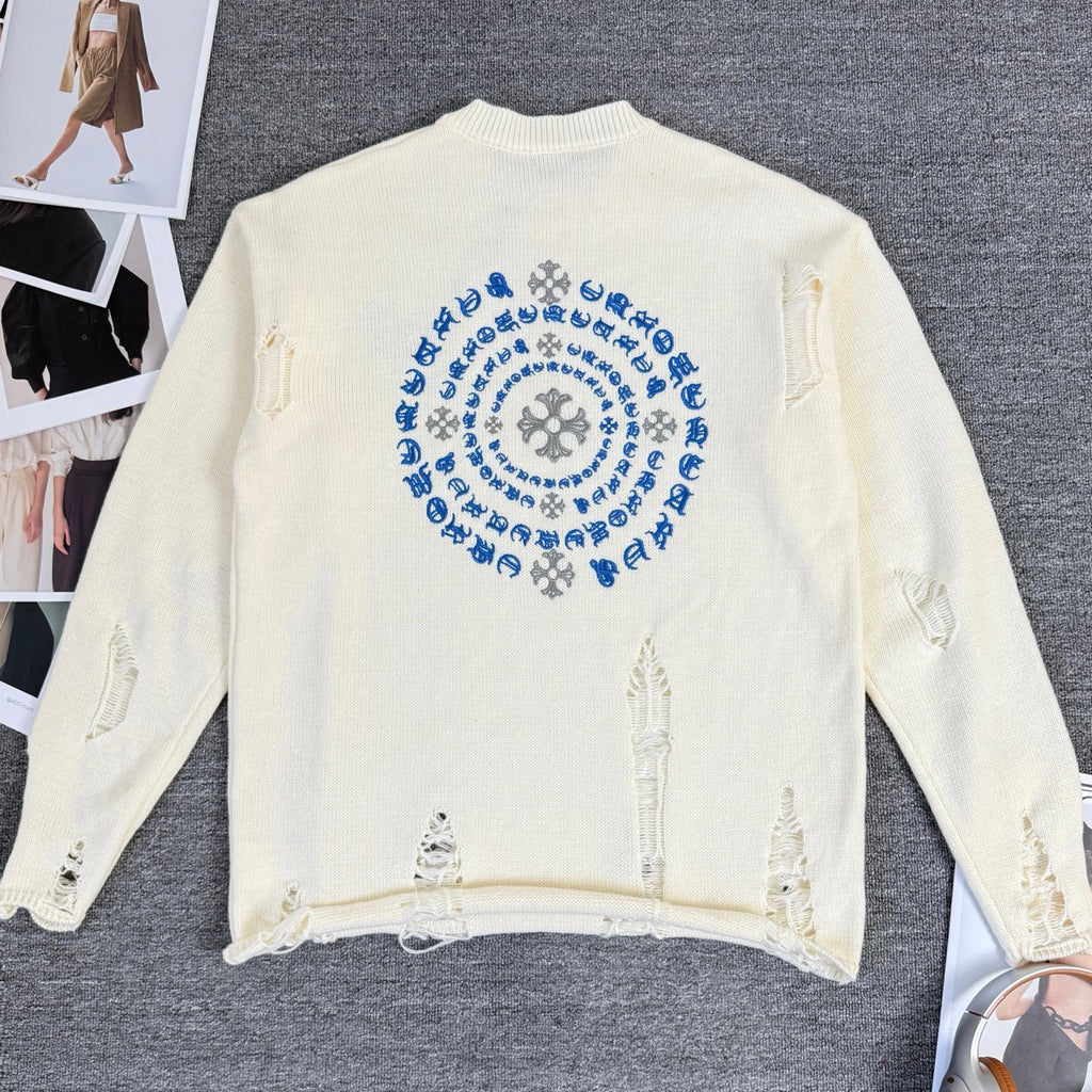 Cream knit sweater with large blue circular embroidery on back