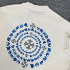 Cream knit sweater back showing blue circular motif embroidery
