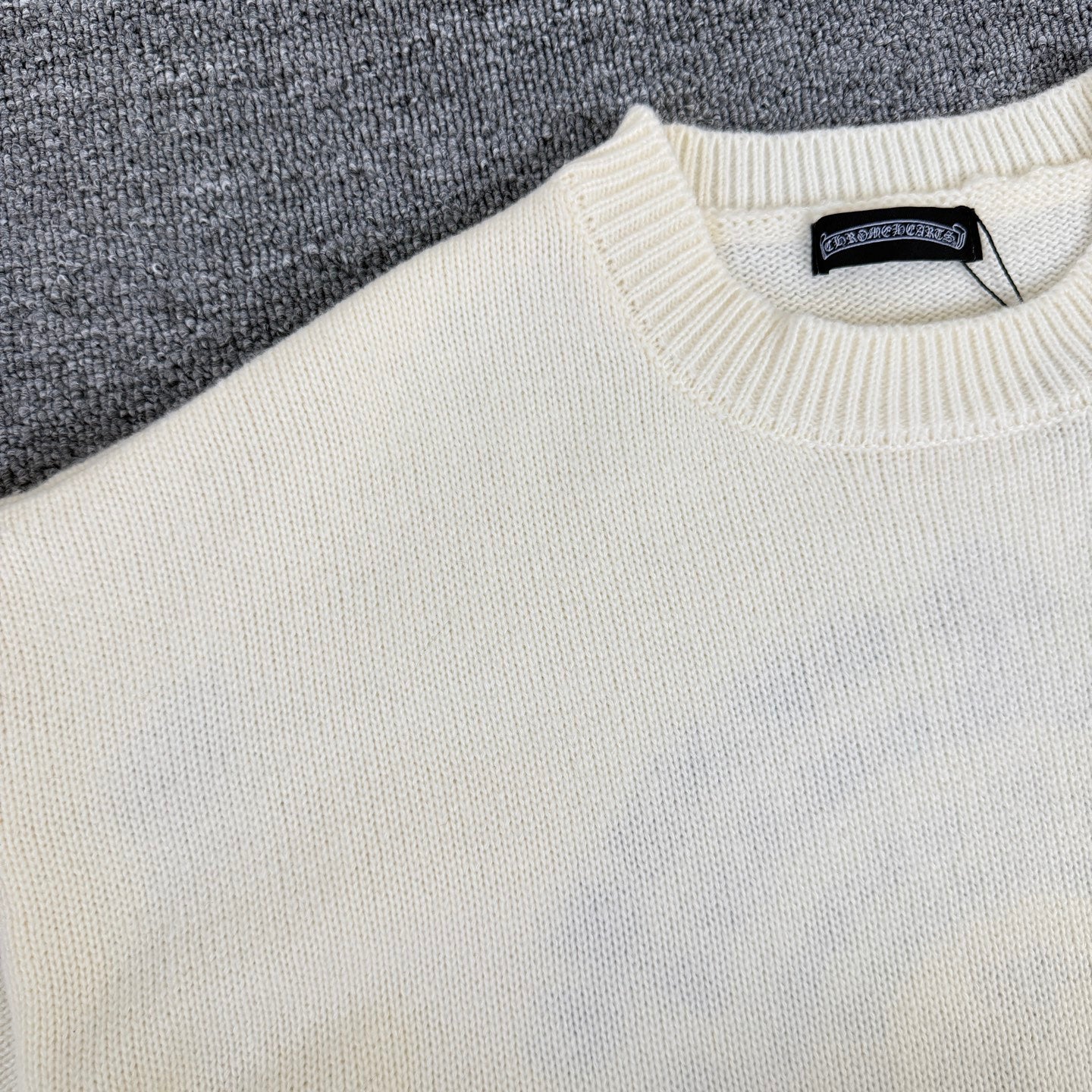 Cream knit sweater upper body with ribbed collar detail