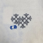 Cream knit sweater chest graphic with gray floral motif and blue accent