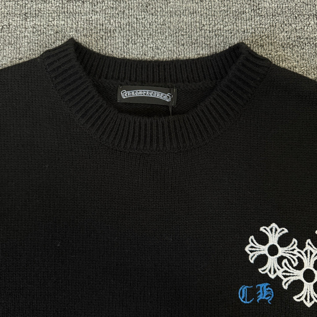Black long-sleeve sweater with ribbed crew neck and white-blue chest embroidery