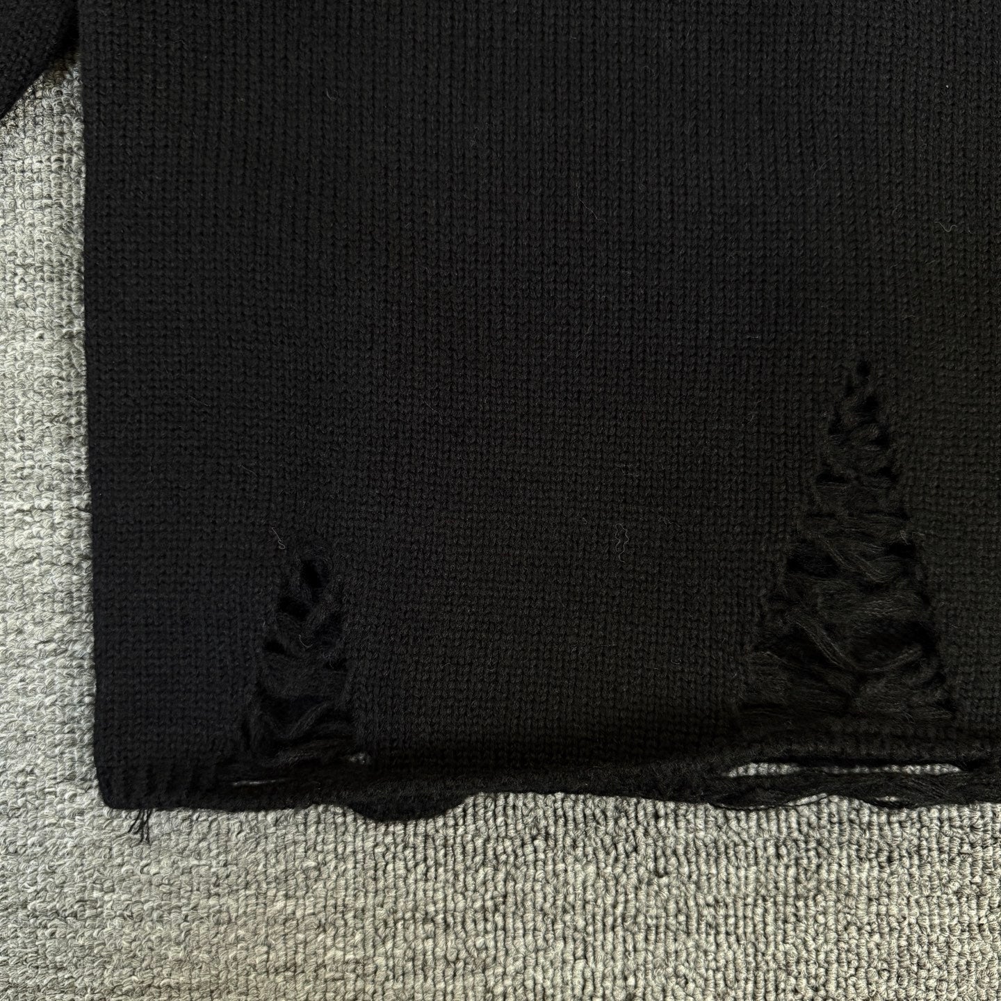 Long-sleeve sweater hem with subtle decorative knit trim