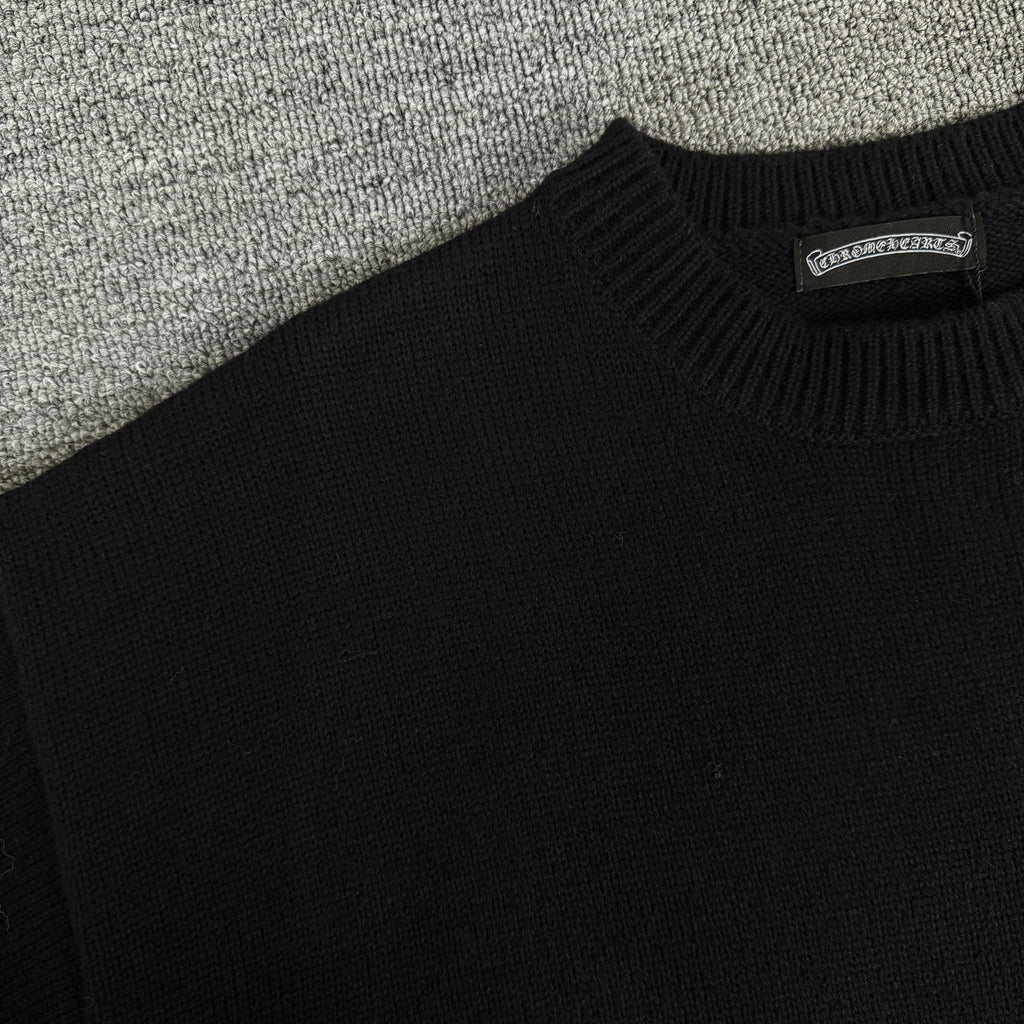 Black long-sleeve sweater knit with ribbed crew neck