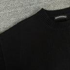 Black long-sleeve sweater knit with ribbed crew neck