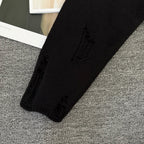 Long-sleeve sweater with decorative knit detail on sleeve cuff